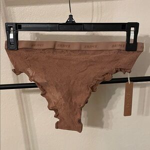 Skims cheeky brief in knit lace